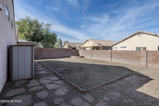 view of yard featuring a patio area and a fenced backyard