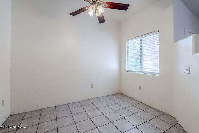 empty room featuring light tile patterned floors and ceiling fan