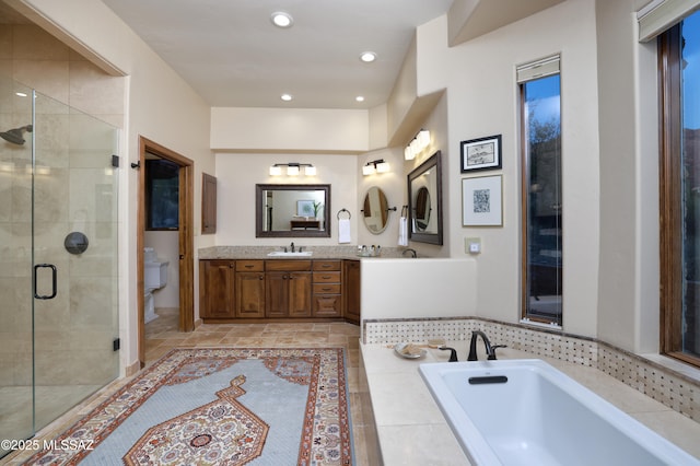 full bathroom featuring toilet, vanity, and plus walk in shower