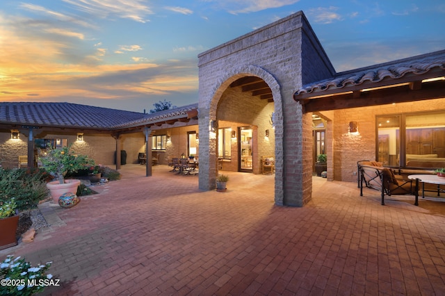 view of patio terrace at dusk