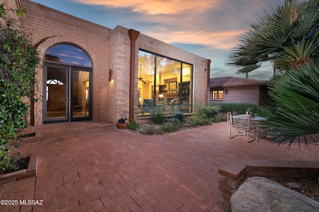 view of patio terrace at dusk