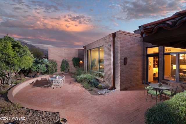 view of patio terrace at dusk