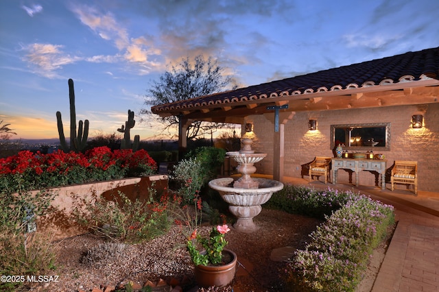 view of patio terrace at dusk