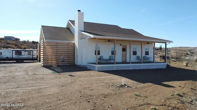 back of house featuring covered porch