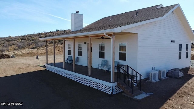 back of house with ceiling fan