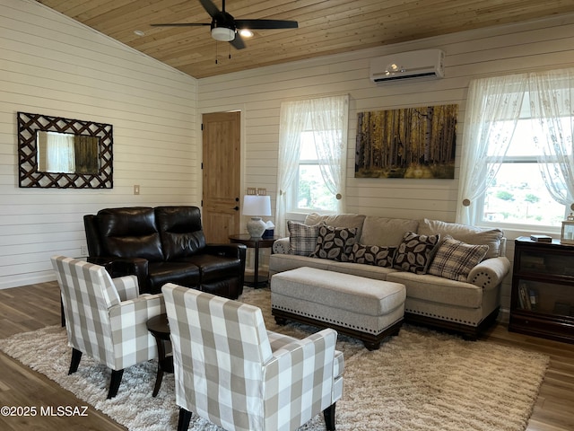 16911 S Joshua Tree Rd, Mayer, AZ 86333 - living room with a wall unit AC, wood ceiling, plenty of natural light, ceiling fan, and wood finished floors
