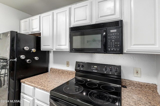 kitchen featuring white cabinetry and black appliances