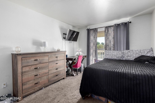 bedroom featuring access to outside and light colored carpet