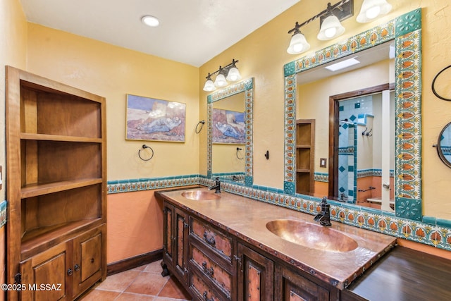 bathroom with tile patterned floors and vanity