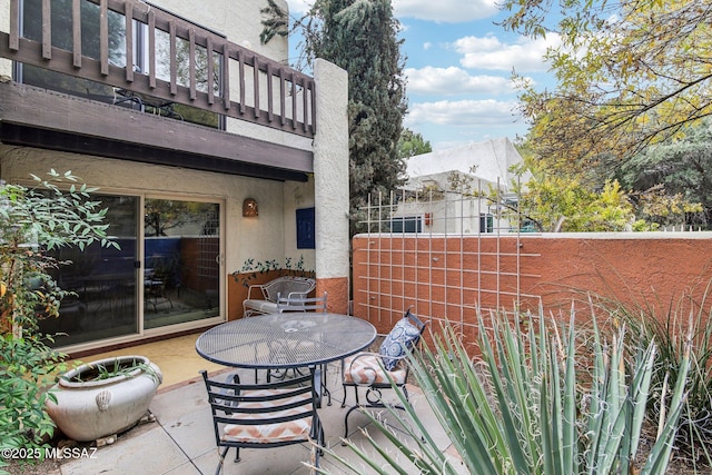 view of patio / terrace with a balcony