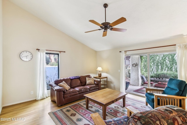 living room featuring high vaulted ceiling, light hardwood / wood-style flooring, and ceiling fan