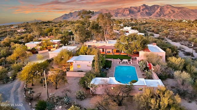 aerial view at dusk with a mountain view