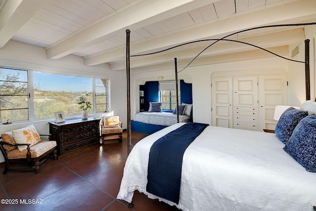 tiled bedroom featuring wooden ceiling, beam ceiling, and a closet