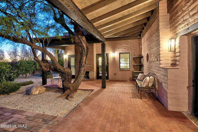 view of patio with an outdoor stone fireplace