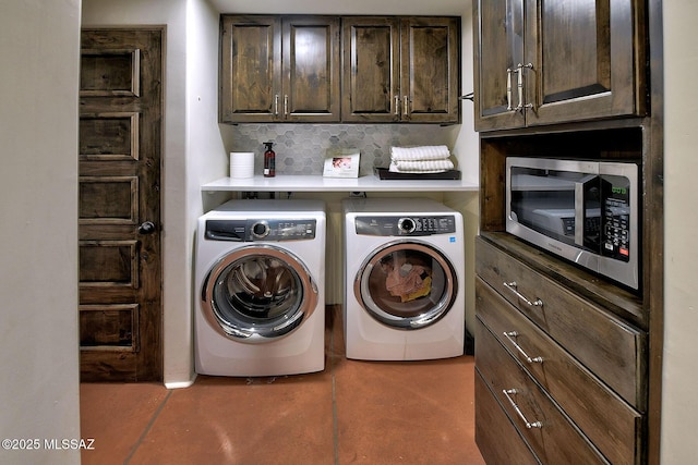 laundry area with cabinets and separate washer and dryer