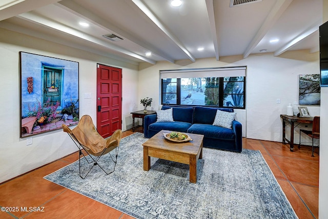 living room featuring beam ceiling and tile patterned flooring