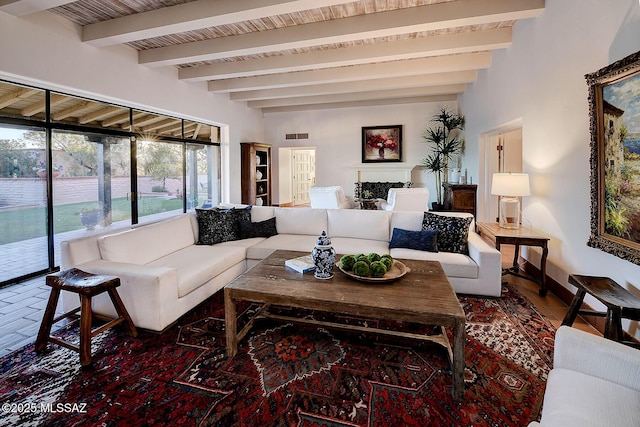 living room featuring beam ceiling