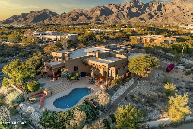 aerial view at dusk with a mountain view