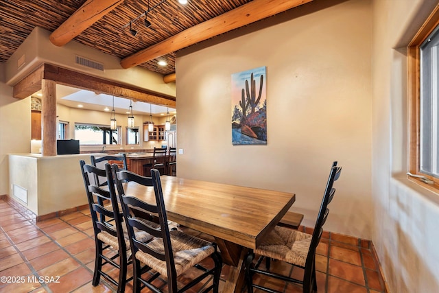 tiled dining space with beam ceiling and wooden ceiling