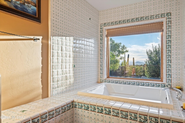 bathroom with tiled tub