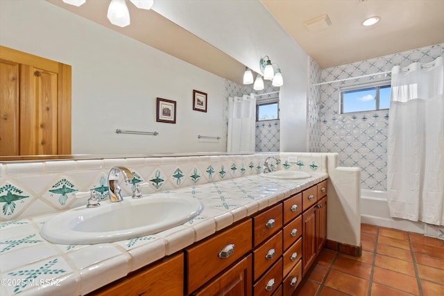 bathroom with tile patterned flooring, decorative backsplash, vanity, and shower / tub combo with curtain