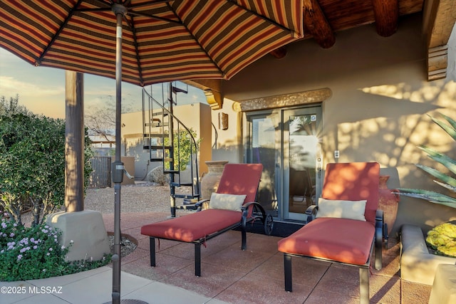 view of patio terrace at dusk