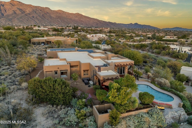 aerial view at dusk with a mountain view