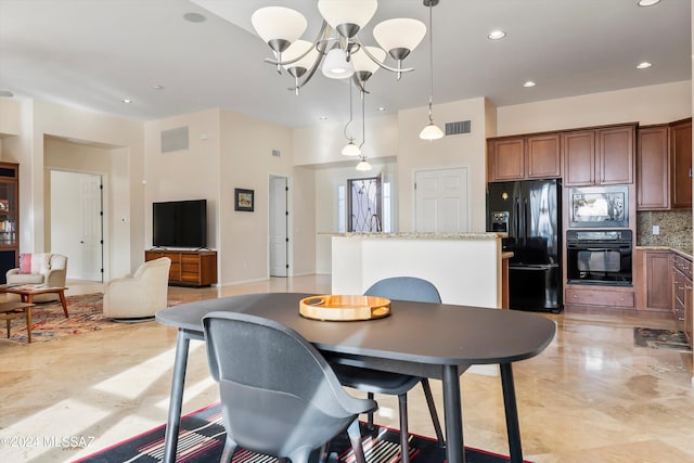 dining area with a notable chandelier