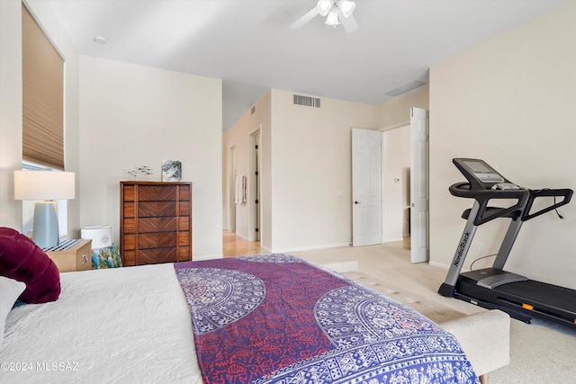 bedroom with ceiling fan and light colored carpet