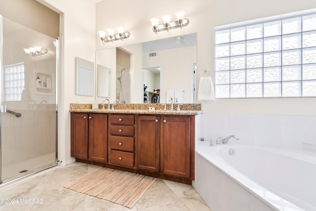 bathroom featuring separate shower and tub and vanity