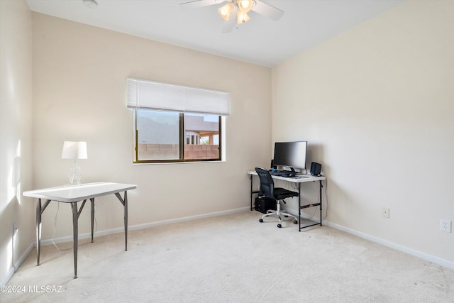 office area featuring light carpet and ceiling fan