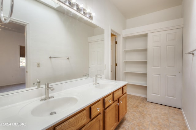 bathroom featuring tile patterned flooring and vanity