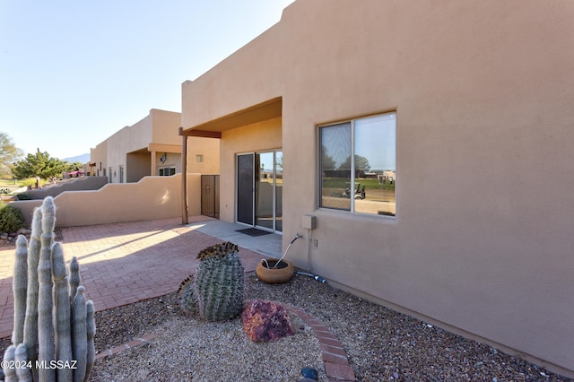 rear view of house featuring a patio