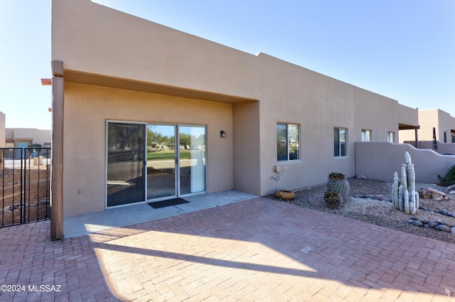 back of property featuring a patio area