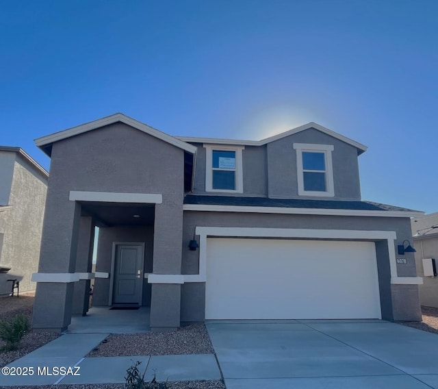 view of front of home with a garage