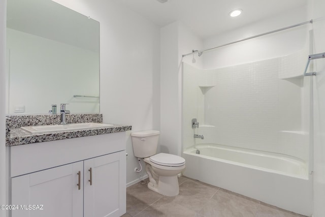 full bathroom featuring washtub / shower combination, vanity, tile patterned flooring, and toilet