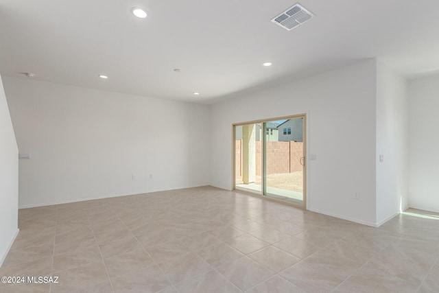 spare room featuring light tile patterned floors