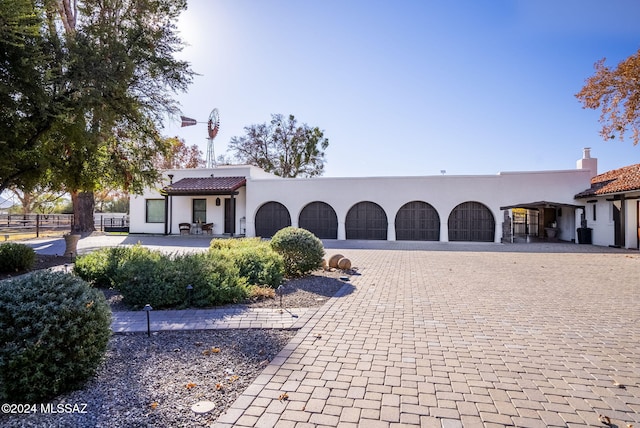 mediterranean / spanish house featuring a garage