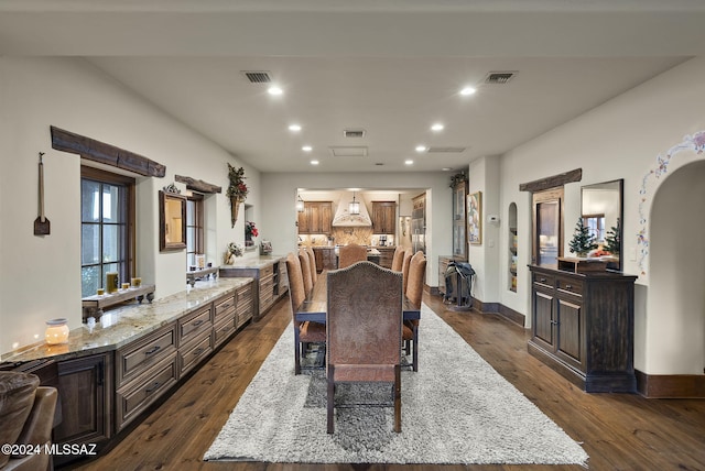 dining space featuring dark hardwood / wood-style flooring