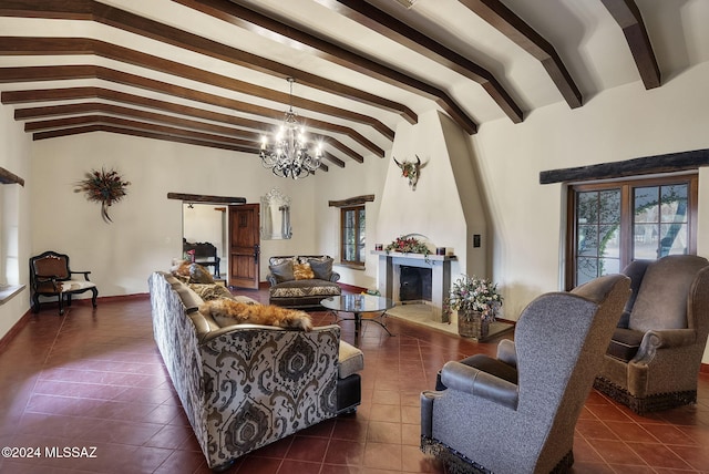 living room featuring lofted ceiling with beams, dark tile patterned floors, and a chandelier