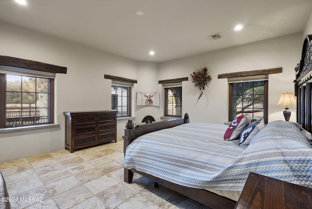 bedroom with multiple windows