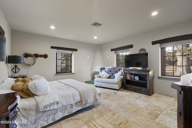 bedroom featuring multiple windows