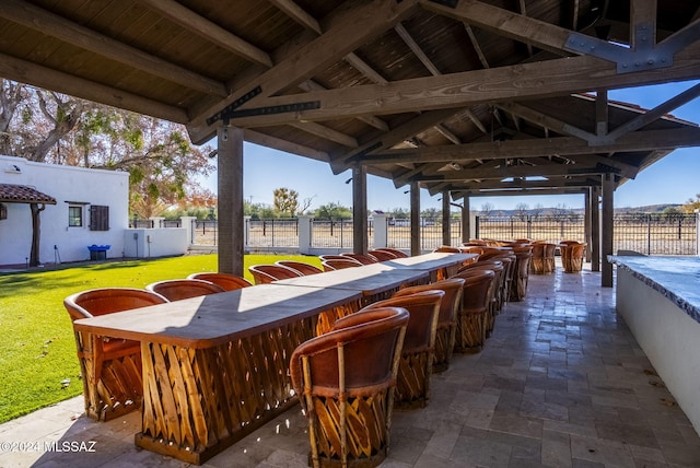 view of patio with a gazebo, exterior bar, and a rural view