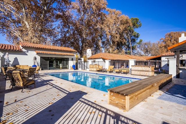 view of swimming pool with a patio area