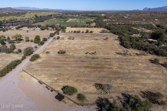 drone / aerial view with a mountain view and a rural view