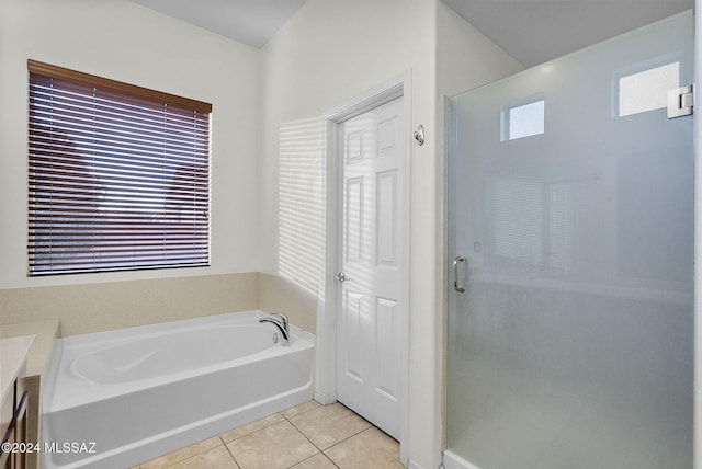 bathroom featuring tile patterned floors, a wealth of natural light, vanity, and independent shower and bath