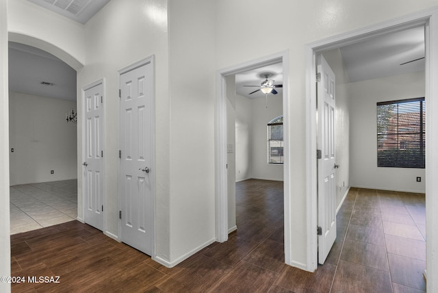 hallway with dark hardwood / wood-style floors