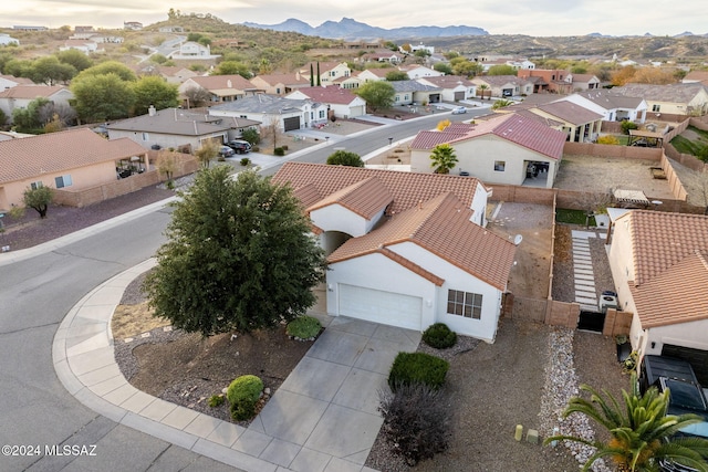 birds eye view of property featuring a mountain view