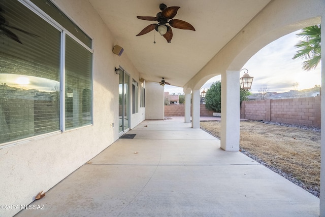 view of patio featuring ceiling fan