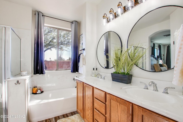 14286 E Lazy Jake Ln, Vail, AZ 85641 - bathroom featuring vanity, hardwood / wood-style flooring, and a tub
